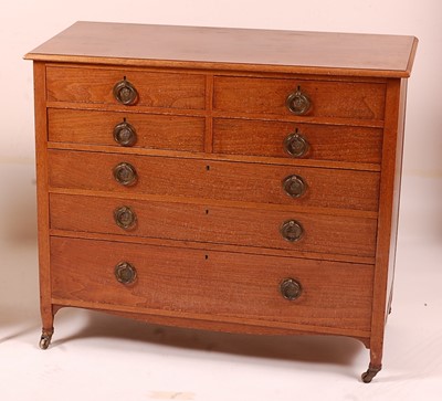 Lot 384 - An Arts & Crafts walnut squarefront chest,...