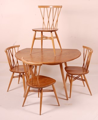 Lot 412 - A 1960s Ercol blond elm breakfast suite,...