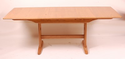 Lot 414 - A contemporary Ercol light elm extending...