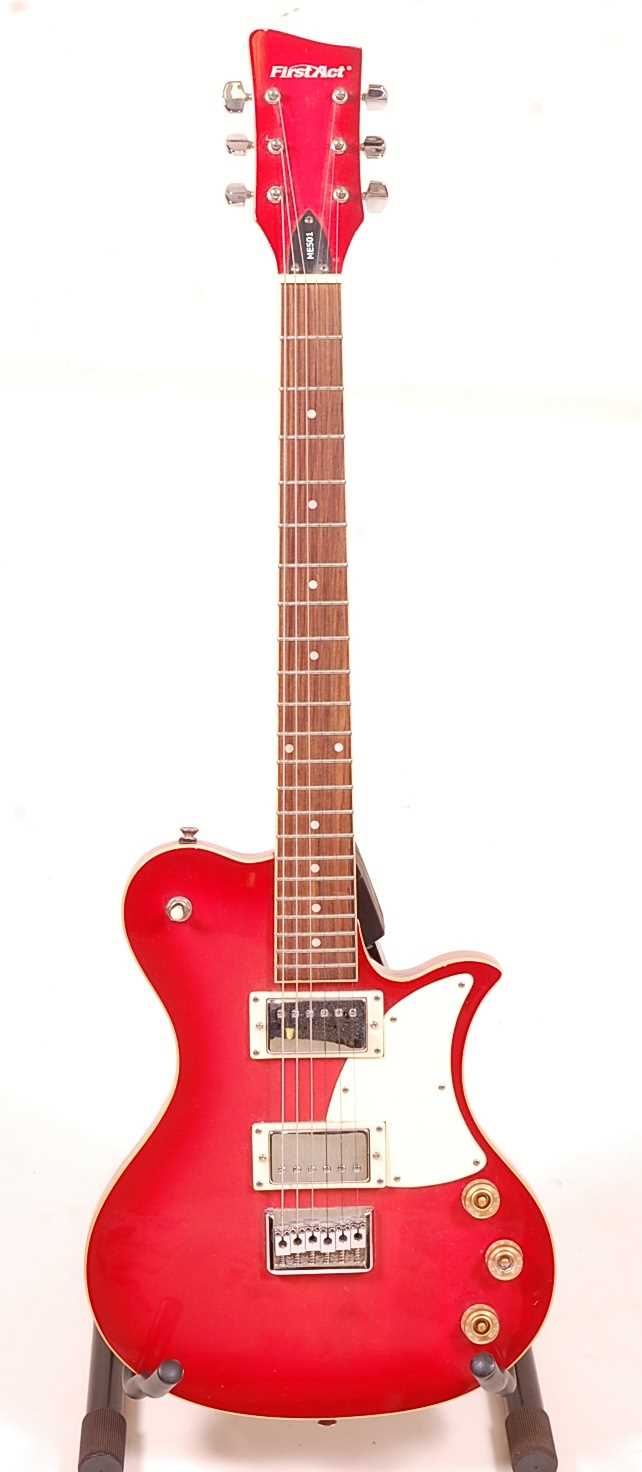 Lot 510 - A First Act ME501 electric guitar, in red...