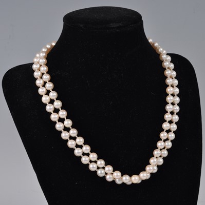 Lot 1150 - A two-row cultured Akoya pearl necklet,...