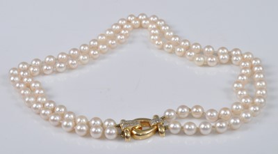 Lot 1150 - A two-row cultured Akoya pearl necklet,...