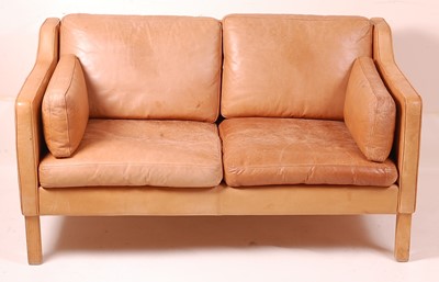 Lot 440 - A Danish 1960s tan leather two-seater sofa,...