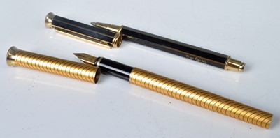 Lot 393 - A Pierre Cardin fountain pen; together with...