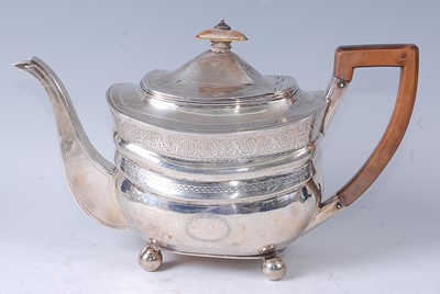 Lot 1067 - A George III silver teapot, of bombe form,...