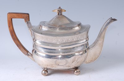 Lot 1067 - A George III silver teapot, of bombe form,...
