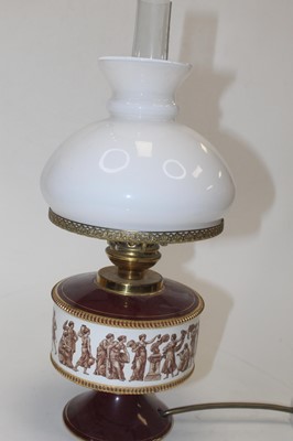 Lot 16 - A ceramic table lamp, the frieze decorated...