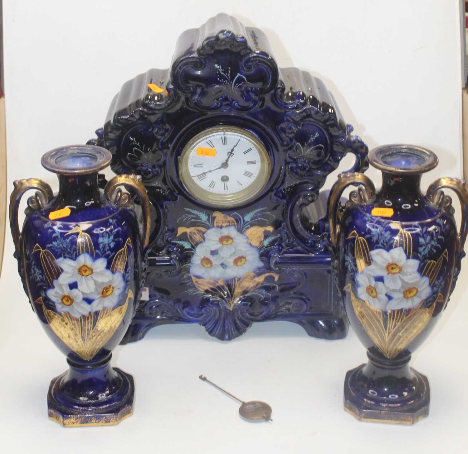 Lot 22 - An early 20th century clock garniture, the...