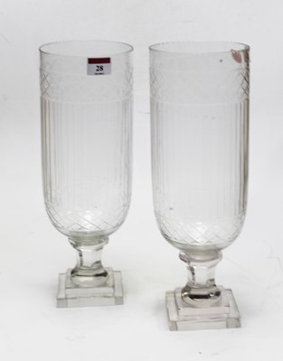 Lot 28 - A pair of modern cut glass storm lamps each on...