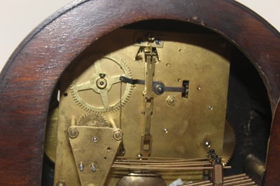 Lot 48 - A 1950s oak cased mantel clock, having a...