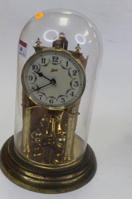 Lot 48 - A 1950s oak cased mantel clock, having a...