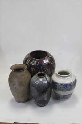 Lot 53 - A stoneware vase, on a white ground having two...