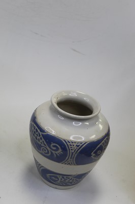 Lot 53 - A stoneware vase, on a white ground having two...