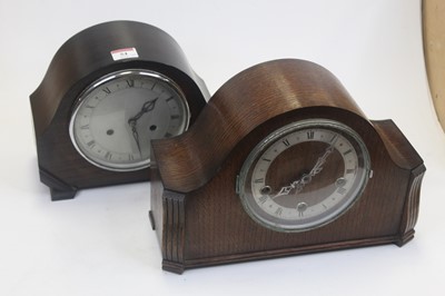 Lot 54 - A 1950s oak cased mantel clock, having a...