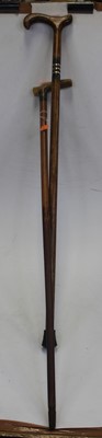 Lot 55 - An early 20th century walking cane, having a...