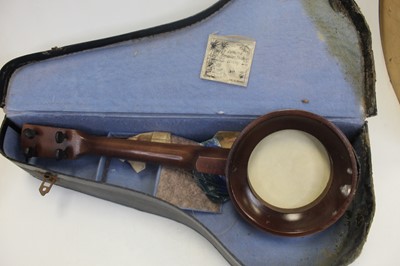 Lot 111 - A mid-20th century banjolele, in black leather...