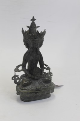 Lot 180 - A modern bronzed figure of a deity, having...