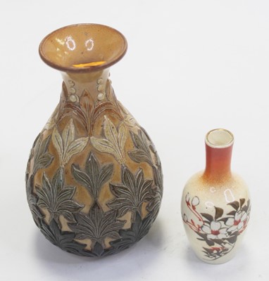 Lot 204 - A small Royal Doulton bottle vase, decorated...