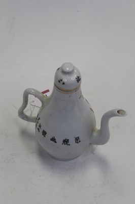 Lot 211 - A Chinese export teapot and cover, on a white...
