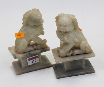 Lot 217 - A pair of polished hardstone figures, each...