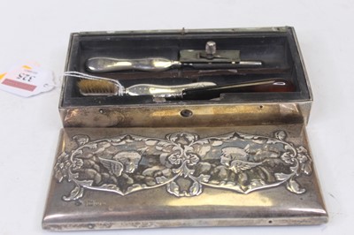 Lot 325 - A circa 1900 silver clad travel case, of...