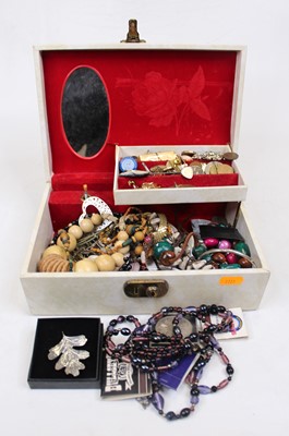 Lot 366 - A cream rexine clad jewellery box and contents,...
