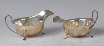 Lot 95 - A pair of 1930s silver sauceboats, each with...