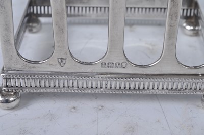 Lot 97 - An Art Deco silver four-division toast rack,...