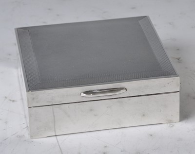 Lot 98 - A 1960s silver engine turned square table...
