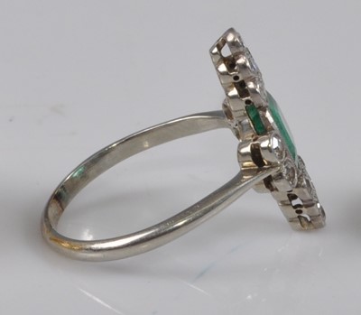 Lot 1148 - A white metal Art Deco emerald and diamond...