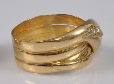 Lot 1147 - A late Victorian yellow metal snake ring, the...