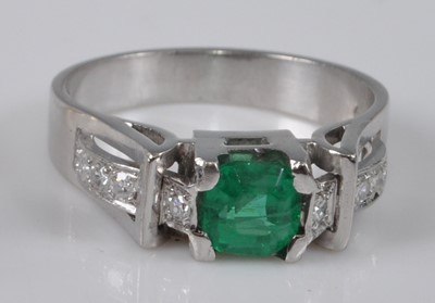 Lot 1130 - A white metal, synthetic emerald and diamond...