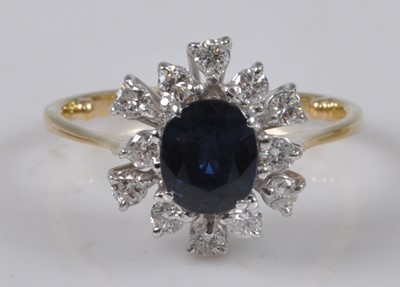Lot 1129 - A yellow and white metal, sapphire and diamond...