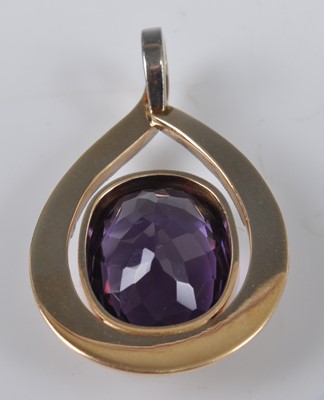 Lot 1139 - A yellow and white gold amethyst pendant,...