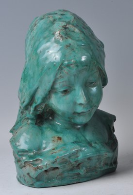 Lot 58 - A green glazed terracotta bust of a young girl,...