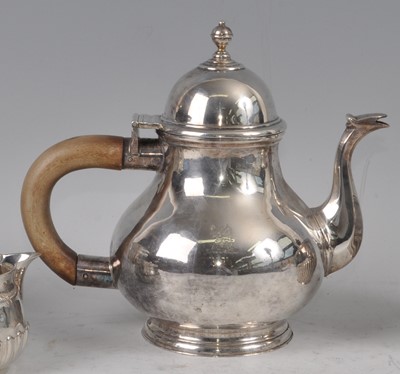 Lot 1082 - A George V Britannia silver teapot, the plain...