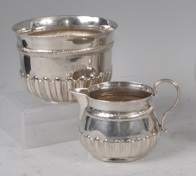 Lot 1081 - A late Victorian silver cream jug and sugar...