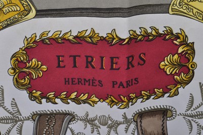 Lot 184 - A vintage Hermès of Paris Etriers silk scarf,...