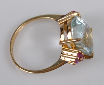 Lot 1117 - A yellow metal, aquamarine and ruby dress ring,...