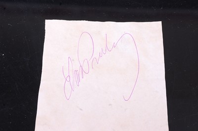Lot 682 - Elvis Presley, autograph in pink ink on paper,...