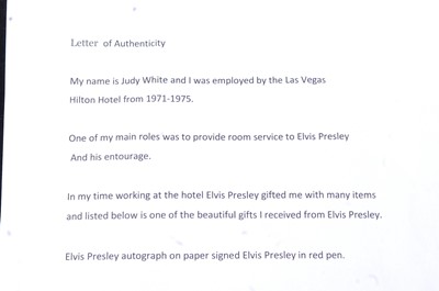 Lot 682 - Elvis Presley, autograph in pink ink on paper,...