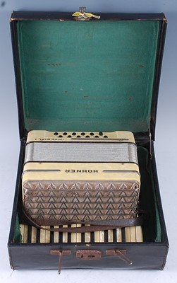 Lot 525 - A Hohner Imperial I accordion, in faux pearl...