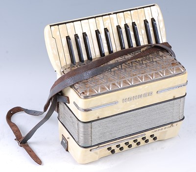 Lot 525 - A Hohner Imperial I accordion, in faux pearl...