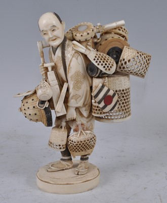 Lot 1236 - A Japanese Meiji period carved ivory okimono...