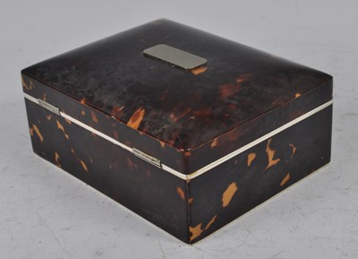 Lot 1203 - An Edwardian tortoiseshell table cigarette box...