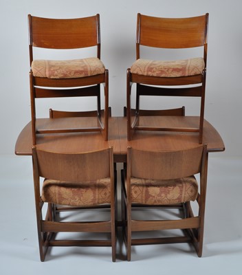 Lot 443 - A 1960s teak dining suite, comprising;...