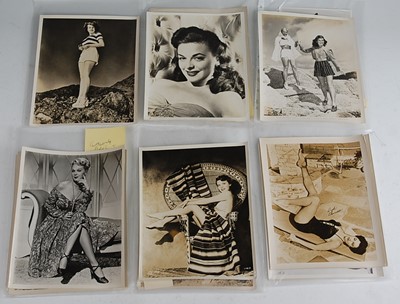 Lot 688 - A collection of black and white photographs...