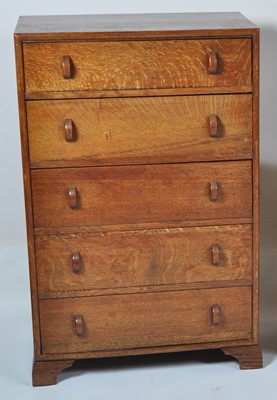 Lot 397 - An Art Deco oak chest of five long drawers,...