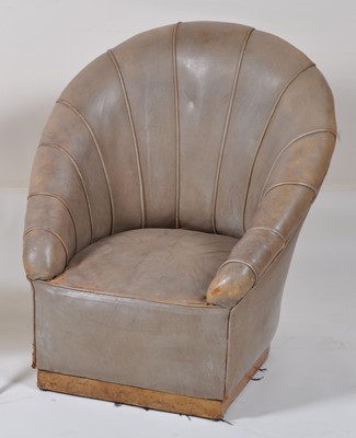 Lot 399 - An Art Deco faded leather tub nursing chair,...