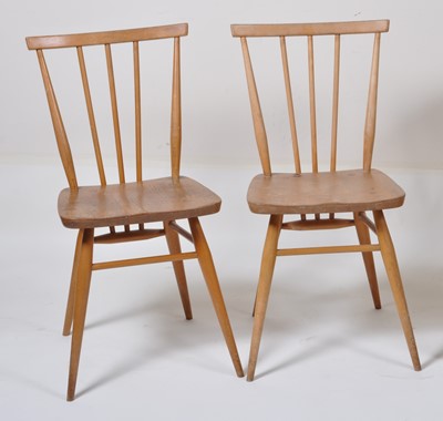 Lot 416 - A pair of 1960s Ercol light elm stickback...